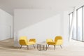 White office waiting room, yellow armchairs Royalty Free Stock Photo