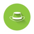 White Oktoberfest hat icon isolated with long shadow background. Hunter hat with feather. German hat. Green circle