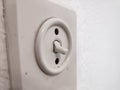 White old light switch on white wall Royalty Free Stock Photo