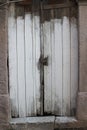 White, old, rusty, typical locked wooden door Royalty Free Stock Photo