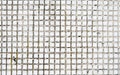 White old tweathered tile background texture captured with a sunlight. Royalty Free Stock Photo