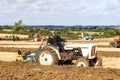 Vintage david brown 770 ploughing on stubble in crop field