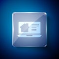 White Online real estate house on laptop icon isolated on blue background. Home loan concept, rent, buy, buying a Royalty Free Stock Photo