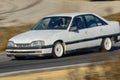 White Opel Omega in a race track