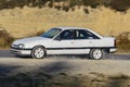 White Opel Omega in a race track