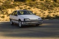 White Opel Omega in a race track