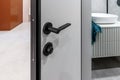 White open bathroom door in the new apartment Royalty Free Stock Photo