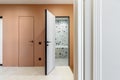 White open bathroom door in the new apartment Royalty Free Stock Photo