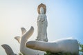 White open hand with Guanyin of the South Sea statue on top of it at Nanshan Buddhism cultural park temple in Sanya Hainan island Royalty Free Stock Photo