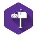White Open mail box with an envelope icon isolated with long shadow. Purple hexagon button Royalty Free Stock Photo