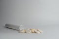 White open pill box with scattered tablets Royalty Free Stock Photo