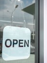 White open sign hanging on the glass door of coffee shop Royalty Free Stock Photo