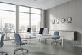 White open space office corner with clocks Royalty Free Stock Photo