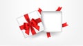 White open square gift box decorated with bow-ribbon red. Top view. Royalty Free Stock Photo