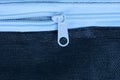 White open zip on black fabric from a piece of clothing Royalty Free Stock Photo