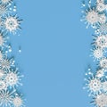 White openwork volumetric snowflakes on a light blue background. Beautiful Christmas 3D greeting card Royalty Free Stock Photo