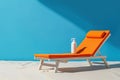 White and orange beach chair with a bottle of sunscreen. Generative AI