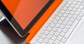White orange convertible laptop and keyboard