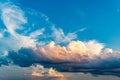 White, orange and dark clouds with blue sky on the sunset summer background Royalty Free Stock Photo