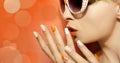 White orange manicure and makeup . Royalty Free Stock Photo