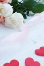 White and Orange-Pink roses on white wooden table. Background for Valentine's day concept Royalty Free Stock Photo