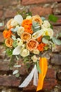 White and orange wedding bouquet