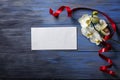 White Orchid and envelope on a blue wooden Royalty Free Stock Photo