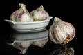 White organic garlic isolated on black glass Royalty Free Stock Photo