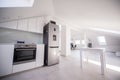 White organised kitchen with modern elements in an apartment