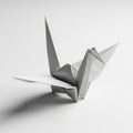 A white origami crane on a smooth surface, showcasing precise folds and sharp angl Royalty Free Stock Photo