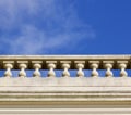 White ornamental stone balustrade against blue sky Royalty Free Stock Photo
