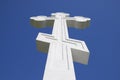 White orthodox christian cross on blue sky background. Royalty Free Stock Photo