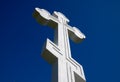 White orthodox christian cross on blue sky background. Royalty Free Stock Photo