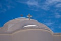 White orthodox greek church with cross on clear blue sky background Royalty Free Stock Photo