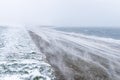 White-out blizzard snow storm on a sea dike in Den Helder, Holland, Netherlands Royalty Free Stock Photo