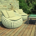 White outdoor furniture on wood resort terrace Royalty Free Stock Photo