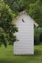 White Outhouse with Moon Cutout