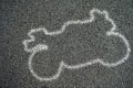 White outline of motorcycle on the Road