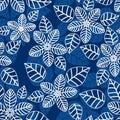 White outlines floral seamless pattern over blue floral background.