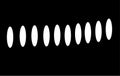 White ovals in row on black background. Minimalistic abstract background or pattern