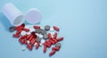 white package a handful of tablets, capsules colored on a blue background. space for text Royalty Free Stock Photo