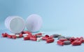 white package a handful of tablets, capsules colored on a blue background. space for text Royalty Free Stock Photo