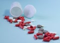 white package a handful of tablets, capsules colored on a blue background. space for text Royalty Free Stock Photo