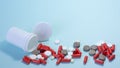 white package a handful of tablets, capsules colored on a blue background. space for text Royalty Free Stock Photo
