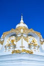 White pagoda with blue sky at Tham Phra Sabai temple