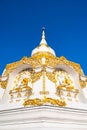 White pagoda with blue sky at Tham Phra Sabai temple