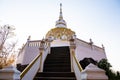 White pagoda with stair walkway at Tham Phra Sabai temple