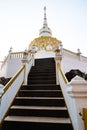 White pagoda with stair walkway at Tham Phra Sabai temple