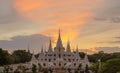 White pagoda or stupa of Asok Maharat buddhist Temple at sunset, Samut Prakan Province, Thailand. Thai architecture. Tourist Royalty Free Stock Photo