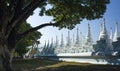 White pagodas of Sanda Muni Paya Buddhist stupa in Mandalay, Myanmar